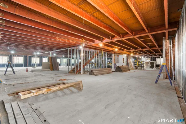 a view of a room with wooden ceiling
