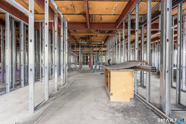 a view of an empty room with stairs