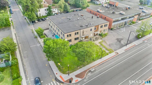 an aerial view of a house with a yard