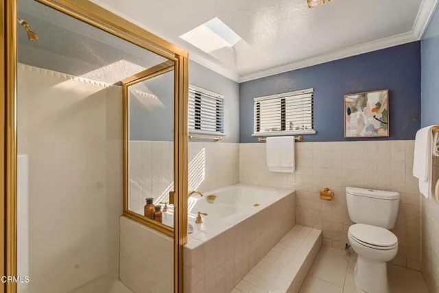 a bathroom with a sink a toilet and tub