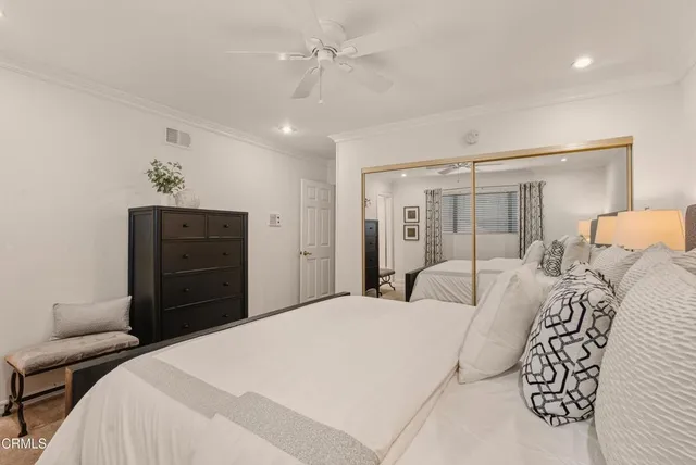 a bedroom with a bed and a dresser