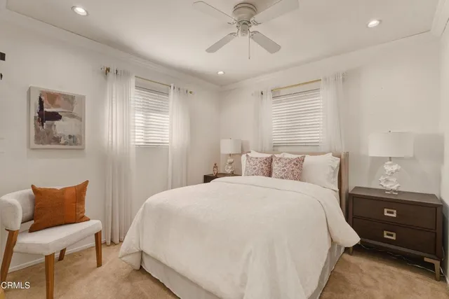 a bedroom with a bed and a chair