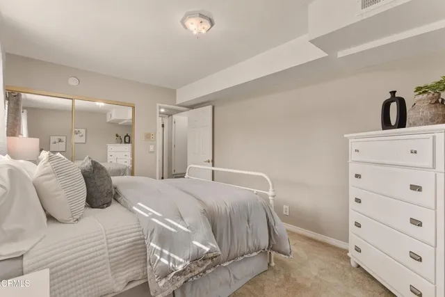 a bedroom with a bed and closet