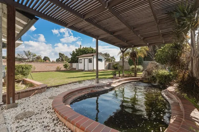 a view of a swimming pool with a patio
