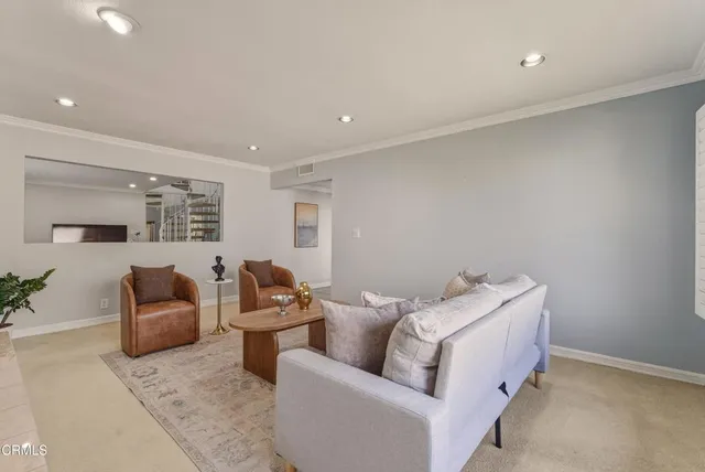 a living room with furniture and a couch