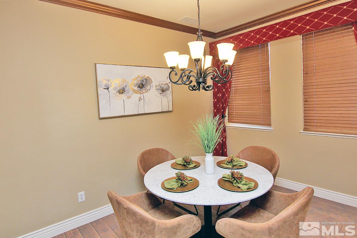 11205 Messina Way Reno, NV 89521 - Photo 13 of 40 a dining room with furniture and window
