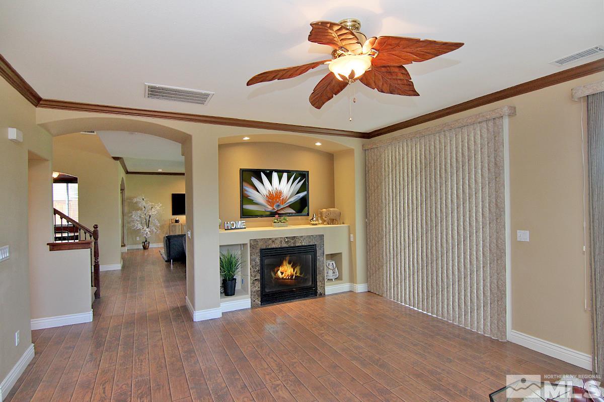 11205 Messina Way Reno, NV 89521 - Photo 18 of 40 a living room with furniture and a fireplace