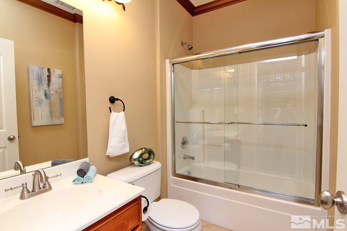 11205 Messina Way Reno, NV 89521 - Photo 29 of 40 a bathroom with a sink toilet and shower