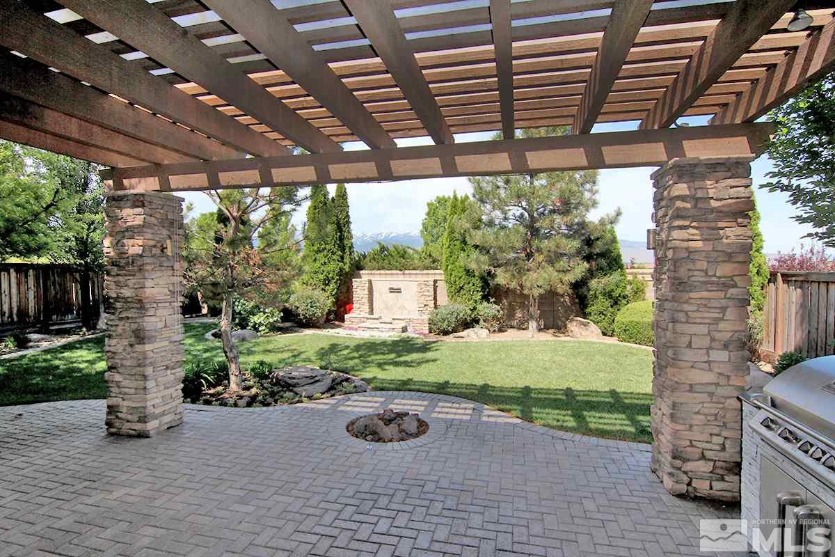 11205 Messina Way Reno, NV 89521 - Photo 35 of 40 a view of a backyard with plants and a patio