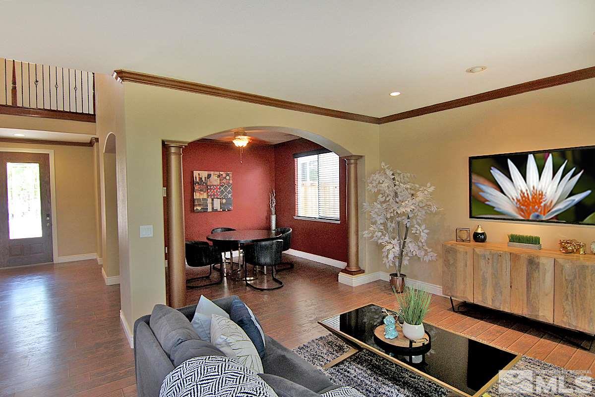 11205 Messina Way Reno, NV 89521 - Photo 5 of 40 a living room with furniture and wooden floor