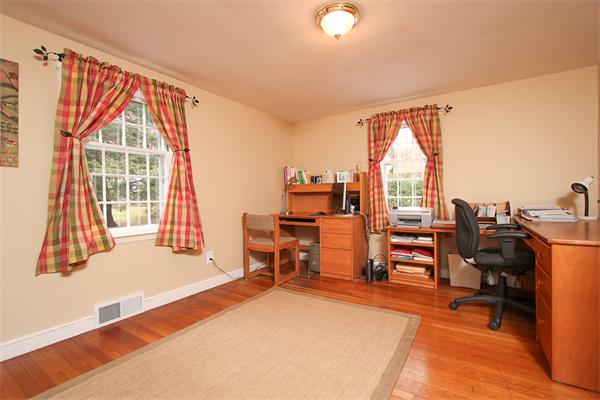 124 Miles River Road Hamilton, MA 01982 - Photo 11 of 22 a view of a workspace with furniture and a window