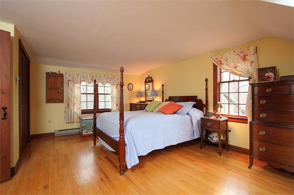 124 Miles River Road Hamilton, MA 01982 - Photo 13 of 22 a bed room with a bed and a window