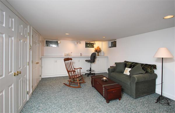 124 Miles River Road Hamilton, MA 01982 - Photo 17 of 22 a living room with furniture and a dining table with wooden floor