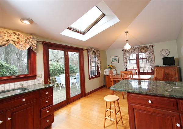 124 Miles River Road Hamilton, MA 01982 - Photo 4 of 22 a kitchen with stainless steel appliances granite countertop sink stove and refrigerator