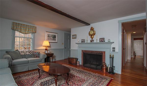 124 Miles River Road Hamilton, MA 01982 - Photo 5 of 22 a living room with furniture and a fireplace