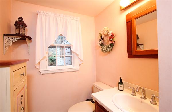 124 Miles River Road Hamilton, MA 01982 - Photo 10 of 22 a bathroom with a toilet sink and mirror