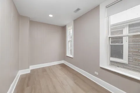 a view of empty room with windows