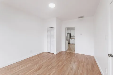 a view of wooden floor in an empty room