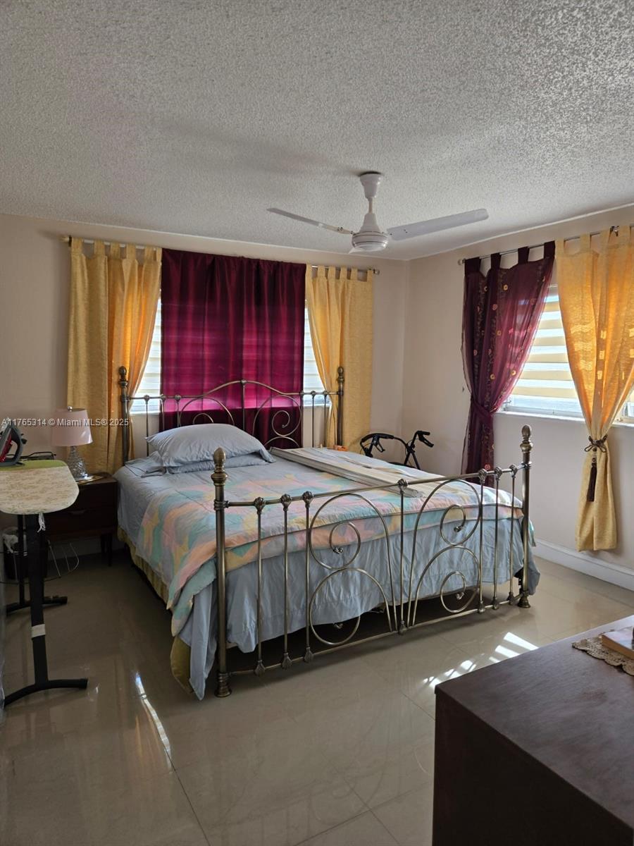 Boynton Beach Boynton Beach, FL 33435 - Photo 14 of 29 a spacious bedroom with a bed and window