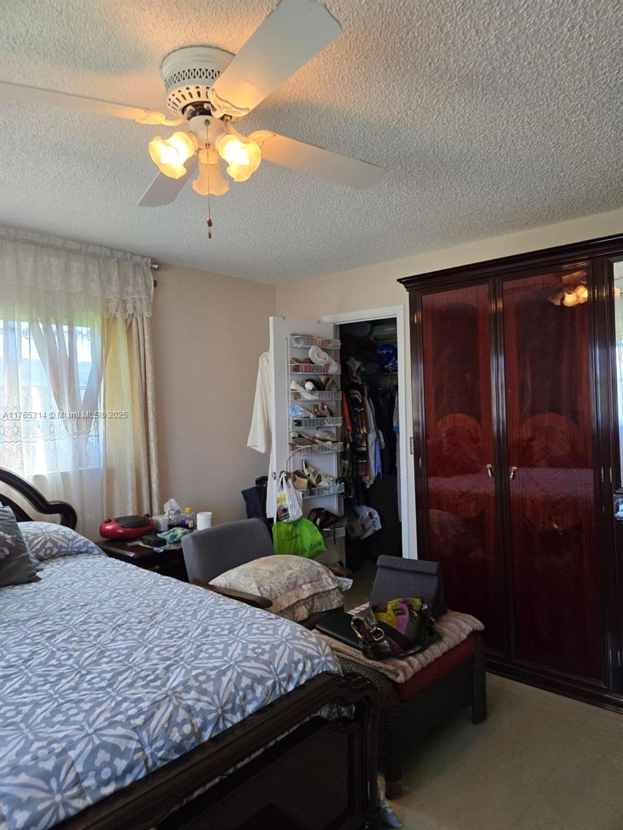 Boynton Beach Boynton Beach, FL 33435 - Photo 15 of 29 a bedroom with a bed and a mirror