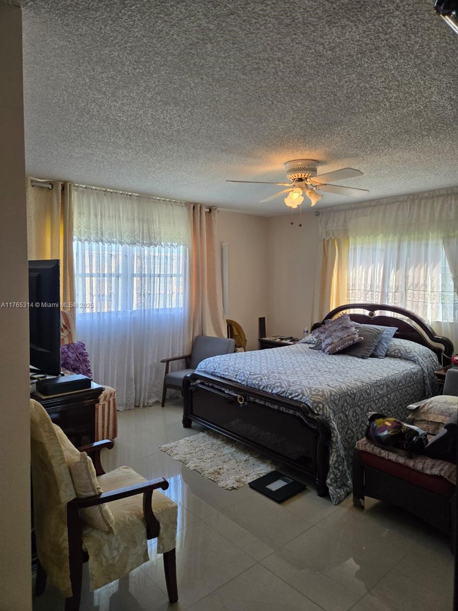 Boynton Beach Boynton Beach, FL 33435 - Photo 17 of 29 a bedroom with a bed and a couch