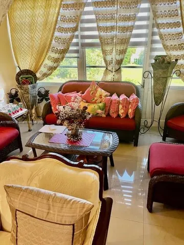 a bedroom with two beds and a window