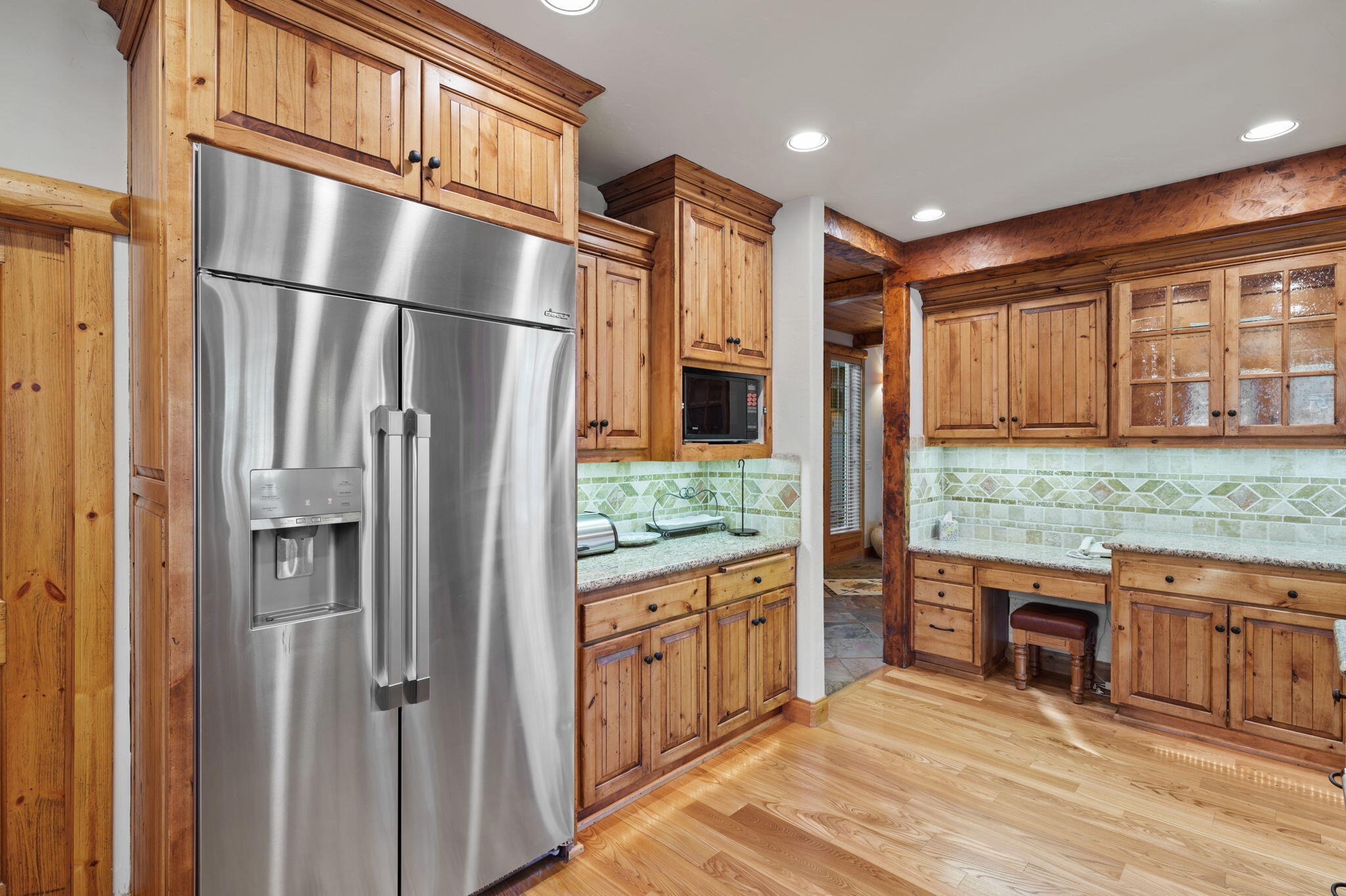58026 Kinglet Road Sunriver, OR 97707 - Photo 16 of 39 a kitchen with stainless steel appliances granite countertop a refrigerator and a stove top oven