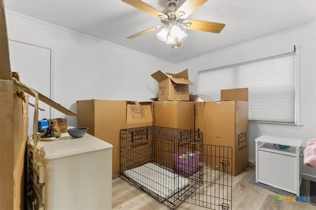a bathroom with a granite countertop sink a mirror a toilet and a shower