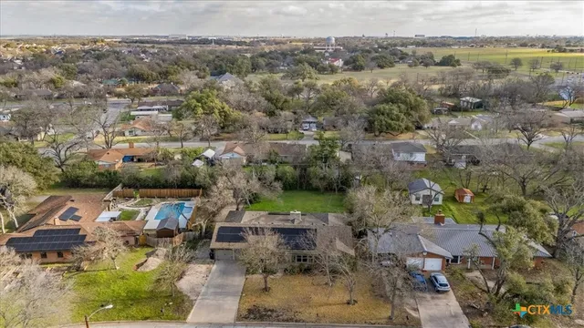 a aerial view of a house with outdoor space