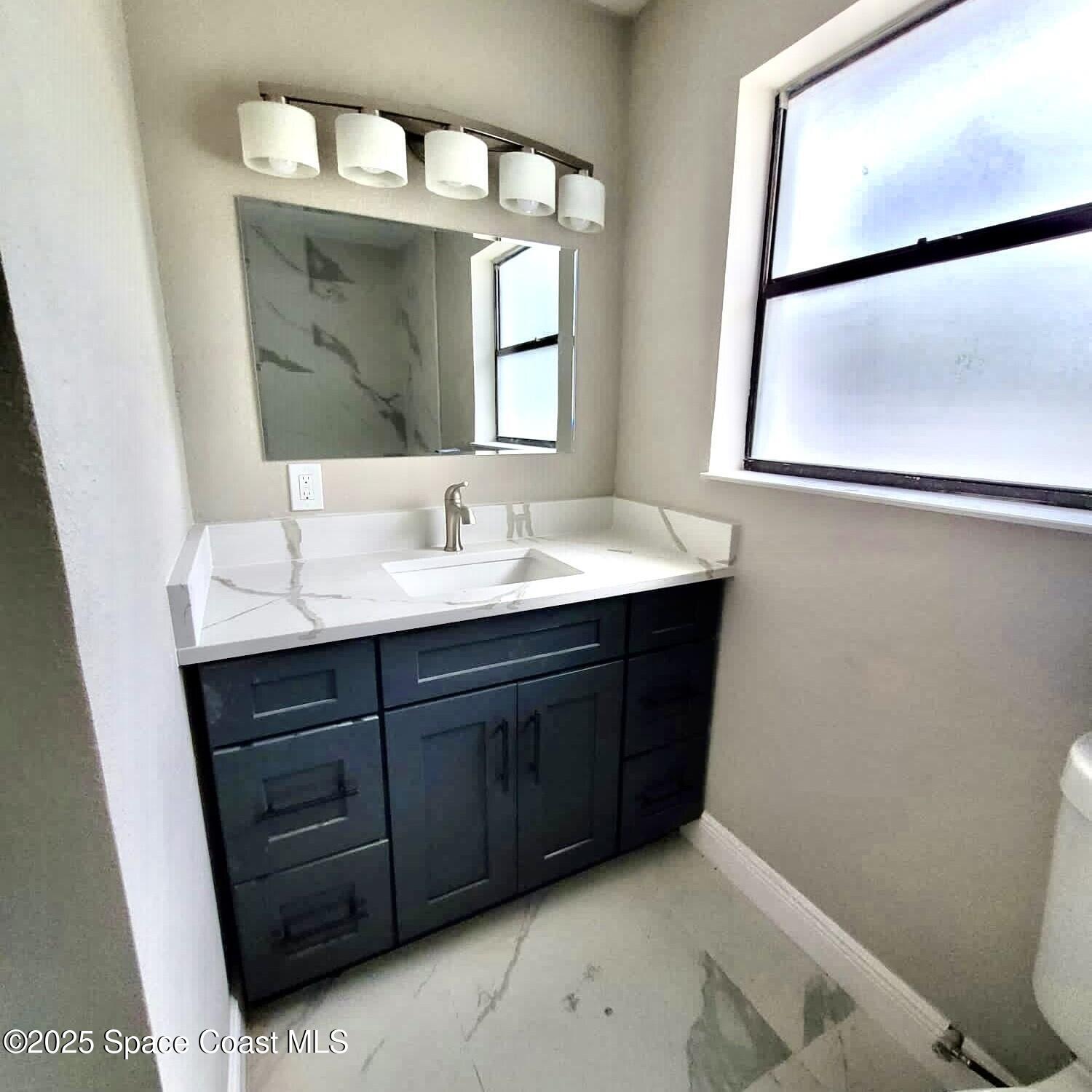 1510 Cambridge Drive Cocoa, FL 32922 - Photo 11 of 19 a bathroom with a sink vanity and a mirror