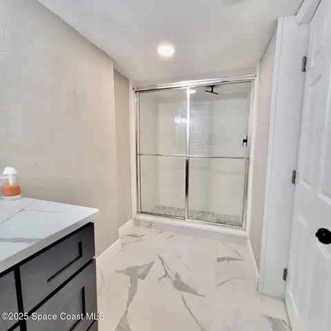 a bathroom with a sink and a shower