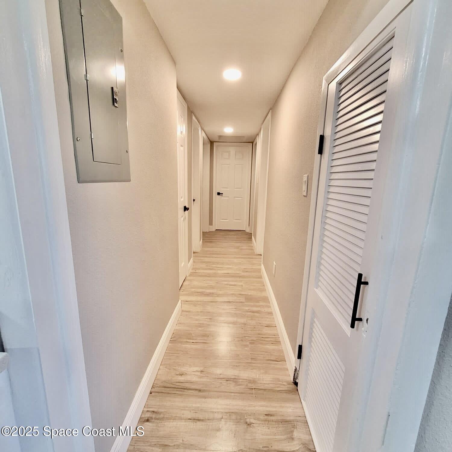 1510 Cambridge Drive Cocoa, FL 32922 - Photo 6 of 19 a view of a hallway with wooden floor and staircase