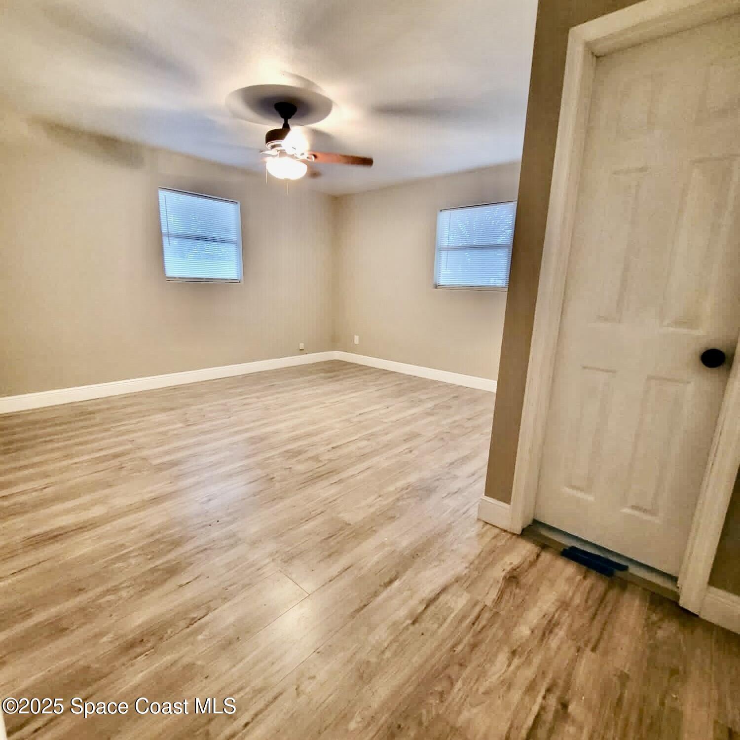 1510 Cambridge Drive Cocoa, FL 32922 - Photo 8 of 19 a view of an empty room with wooden floor