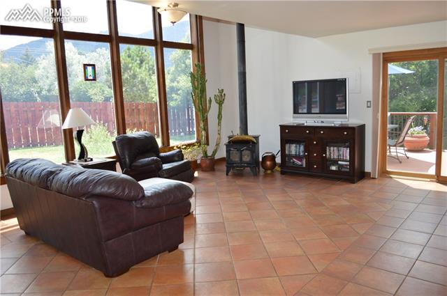 142 Clarksley Road Manitou Springs, CO 80829 - Photo 4 of 10 Front living room with floor to ceilings windows with more views
