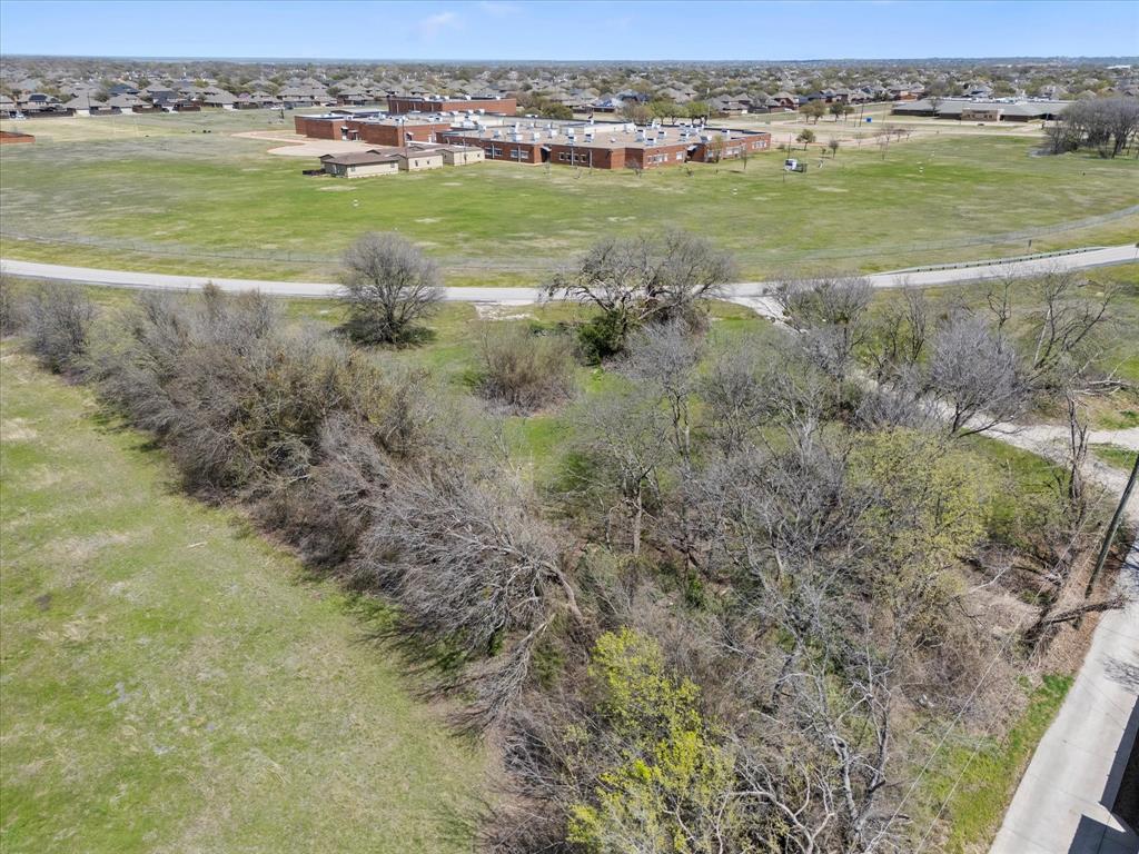 6409 Chiesa Road Rowlett, TX 75089 - Photo 15 of 16 a view of a field with an ocean view