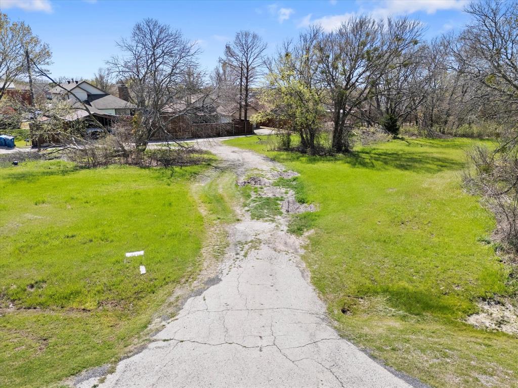 6409 Chiesa Road Rowlett, TX 75089 - Photo 16 of 16 a view of a pathway with a yard