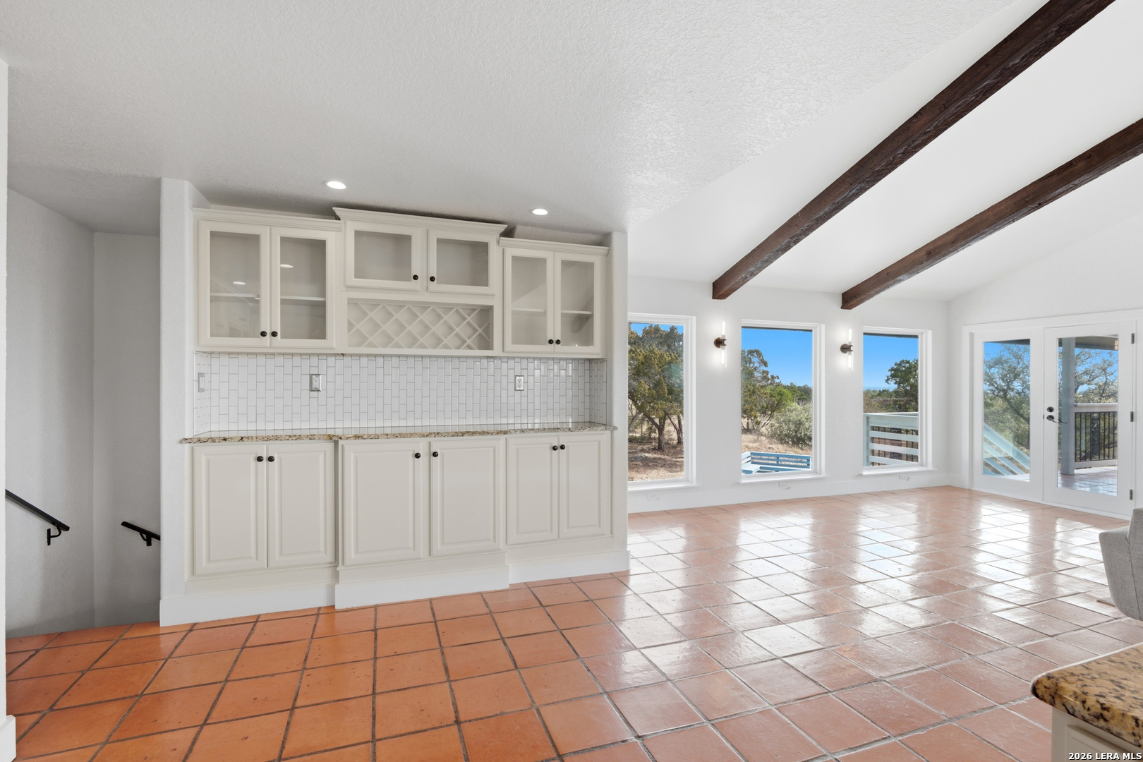 10206 Rafter S Trail Helotes, TX 78023 - Photo 20 of 49 a view of an empty room with window and wooden floor