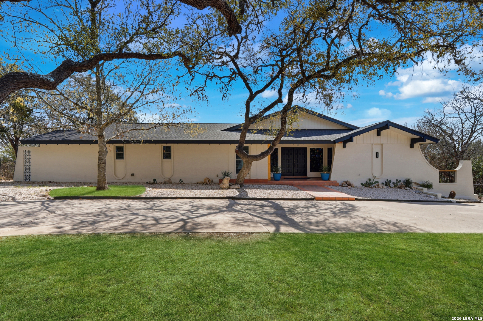 10206 Rafter S Trail Helotes, TX 78023 - Photo 2 of 49 a view of a house with a yard