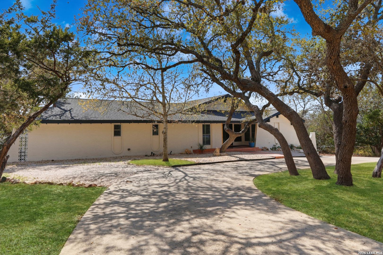 10206 Rafter S Trail Helotes, TX 78023 - Photo 4 of 49 a house that has a tree in front of a house