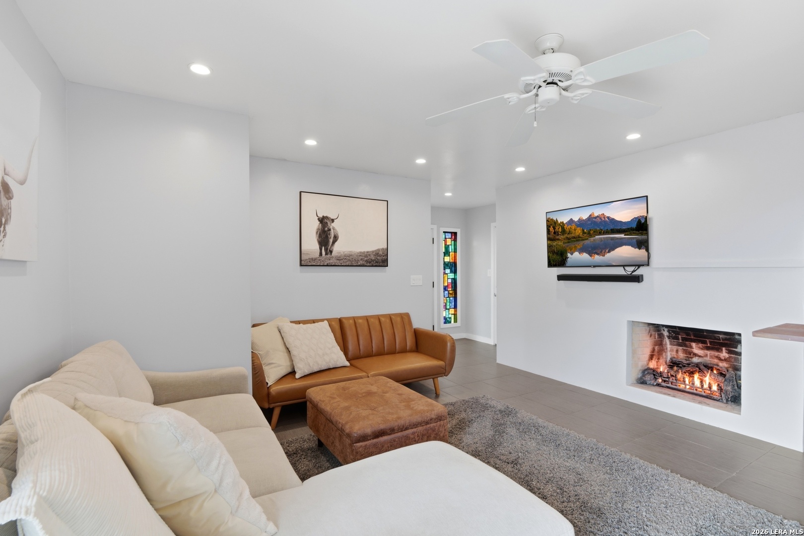 10206 Rafter S Trail Helotes, TX 78023 - Photo 41 of 49 a living room with furniture and a flat screen tv