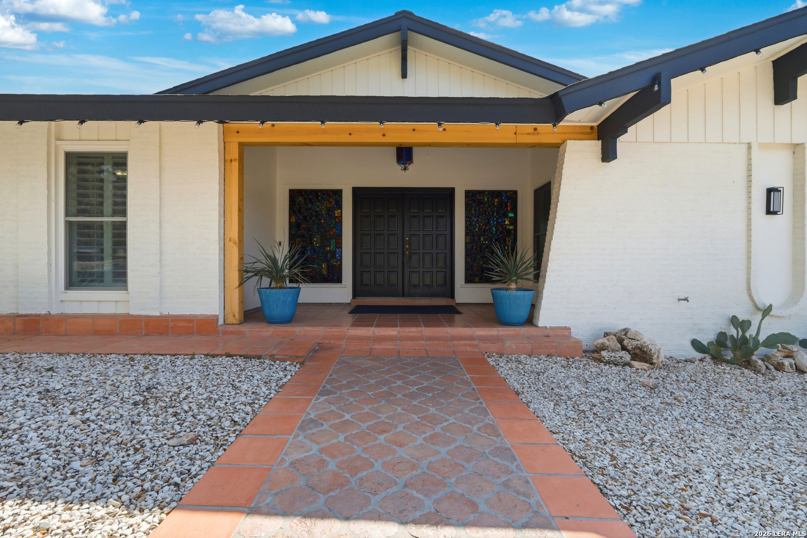10206 Rafter S Trail Helotes, TX 78023 - Photo 8 of 49 a front view of a house with a yard