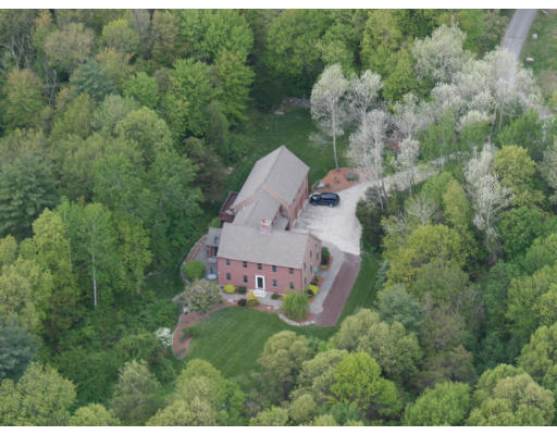 a aerial view of a house with a yard