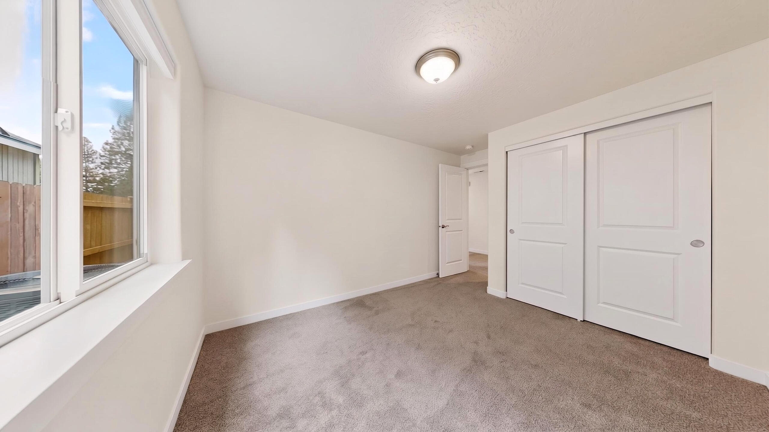 680 McKinney Ranch Road Sisters, OR 97759 - Photo 34 of 41 a view of an empty room with a window