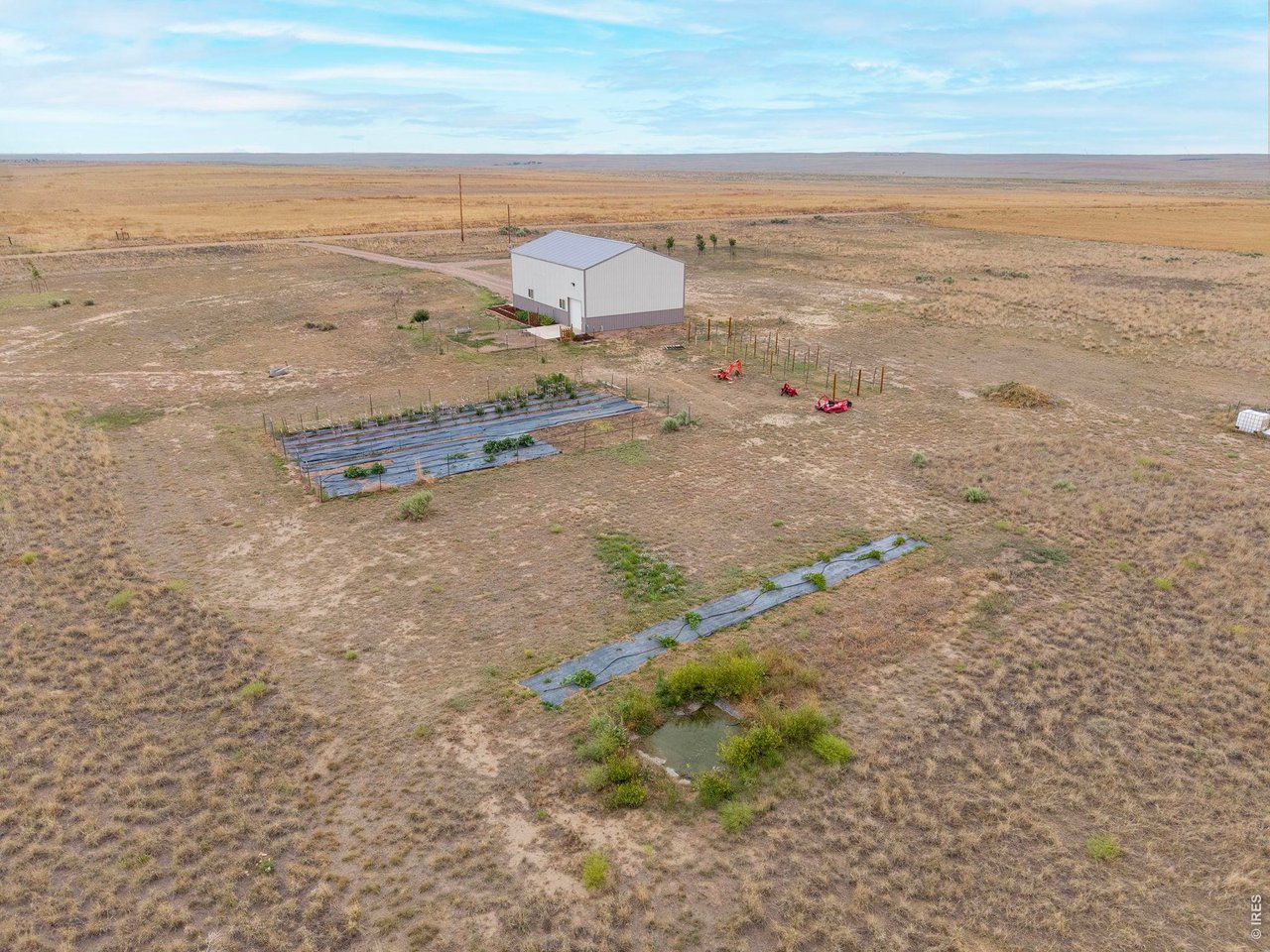 13550 Deter-Winters Road Byers, CO 80103 - Photo 35 of 50 This picture shows the vegetable garden southwest of the barn, the pumpkin patch and the wildlife watering hole in the forefront