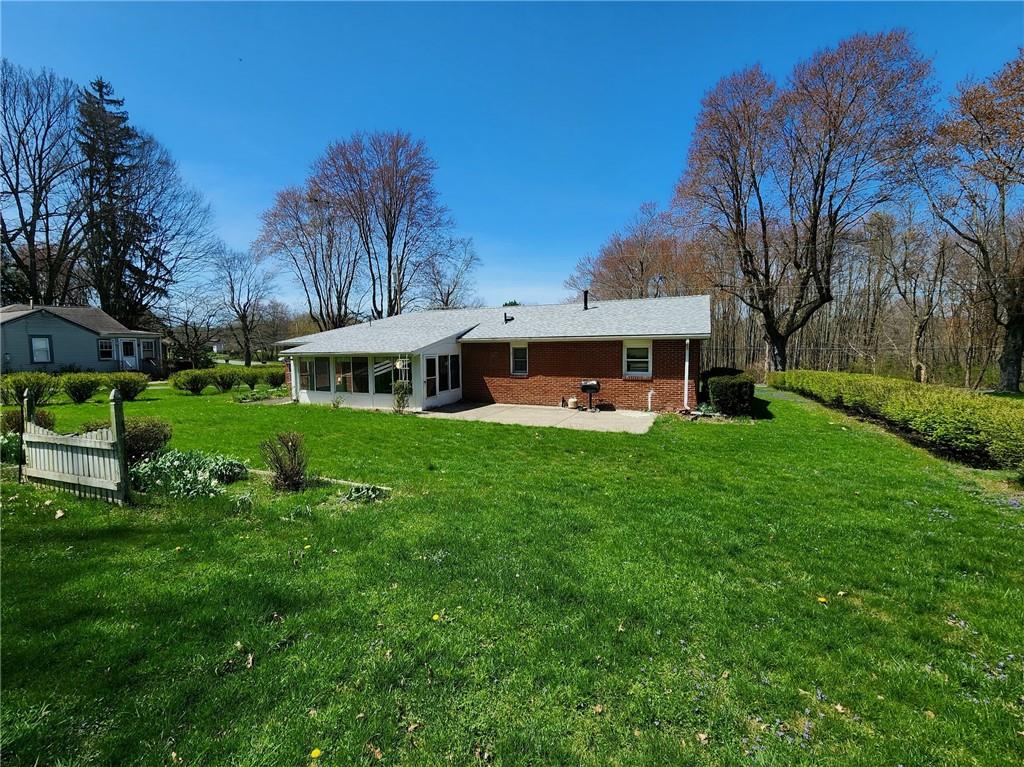 3060 Valley View Road Clark, PA 16113 - Photo 23 of 24 a front view of a house with garden and trees
