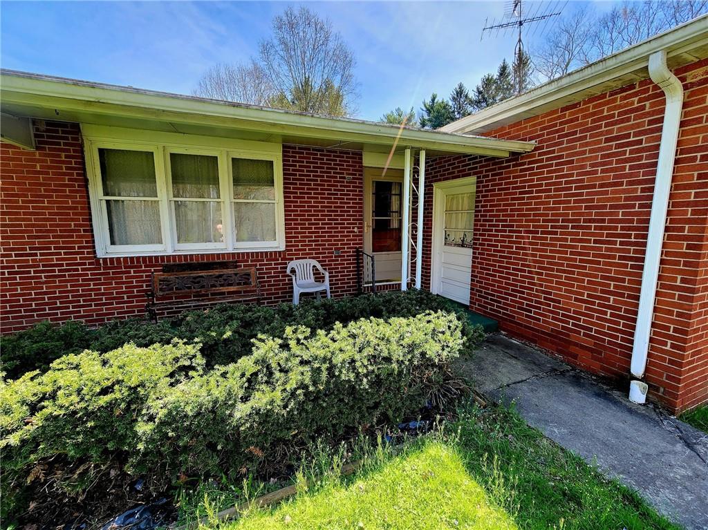 3060 Valley View Road Clark, PA 16113 - Photo 3 of 24 a front view of a house with garden