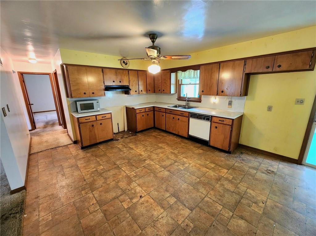 3060 Valley View Road Clark, PA 16113 - Photo 5 of 24 a large kitchen with granite countertop a sink and cabinets