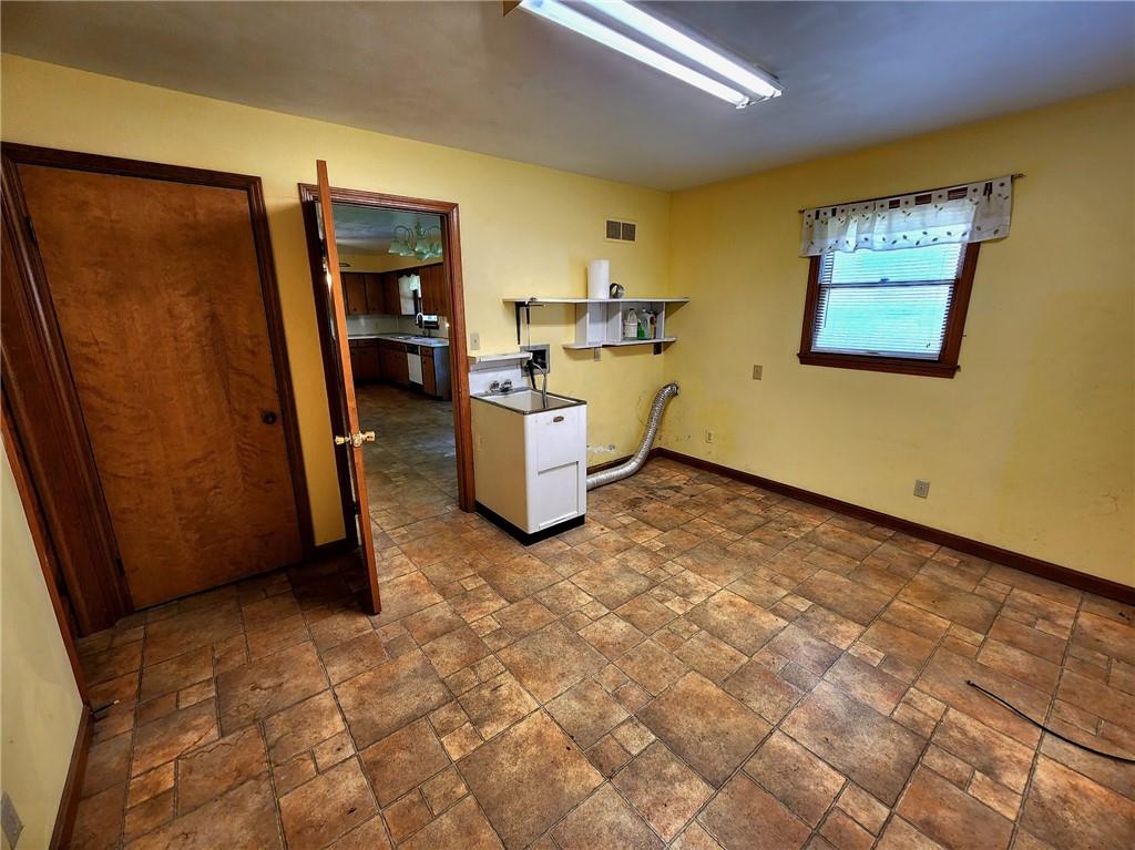3060 Valley View Road Clark, PA 16113 - Photo 7 of 24 a view of a storage & utility room with a window