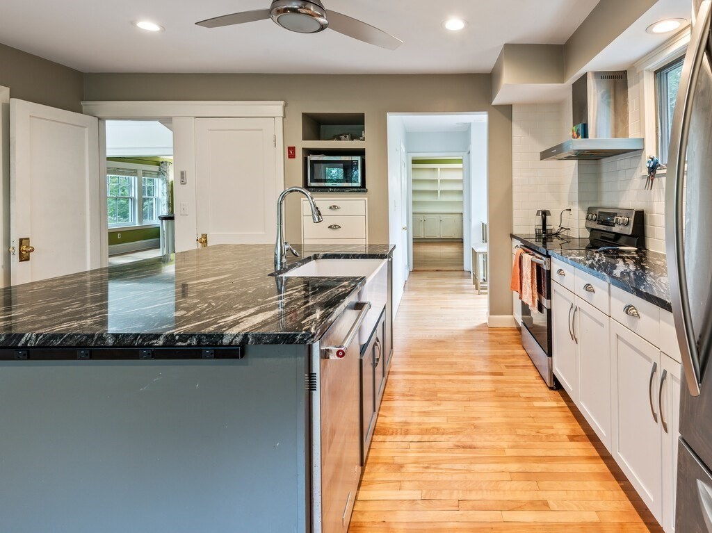 8 Montvale Road Worcester, MA 01609 - Photo 11 of 31 a large kitchen with stainless steel appliances granite countertop a stove and a sink