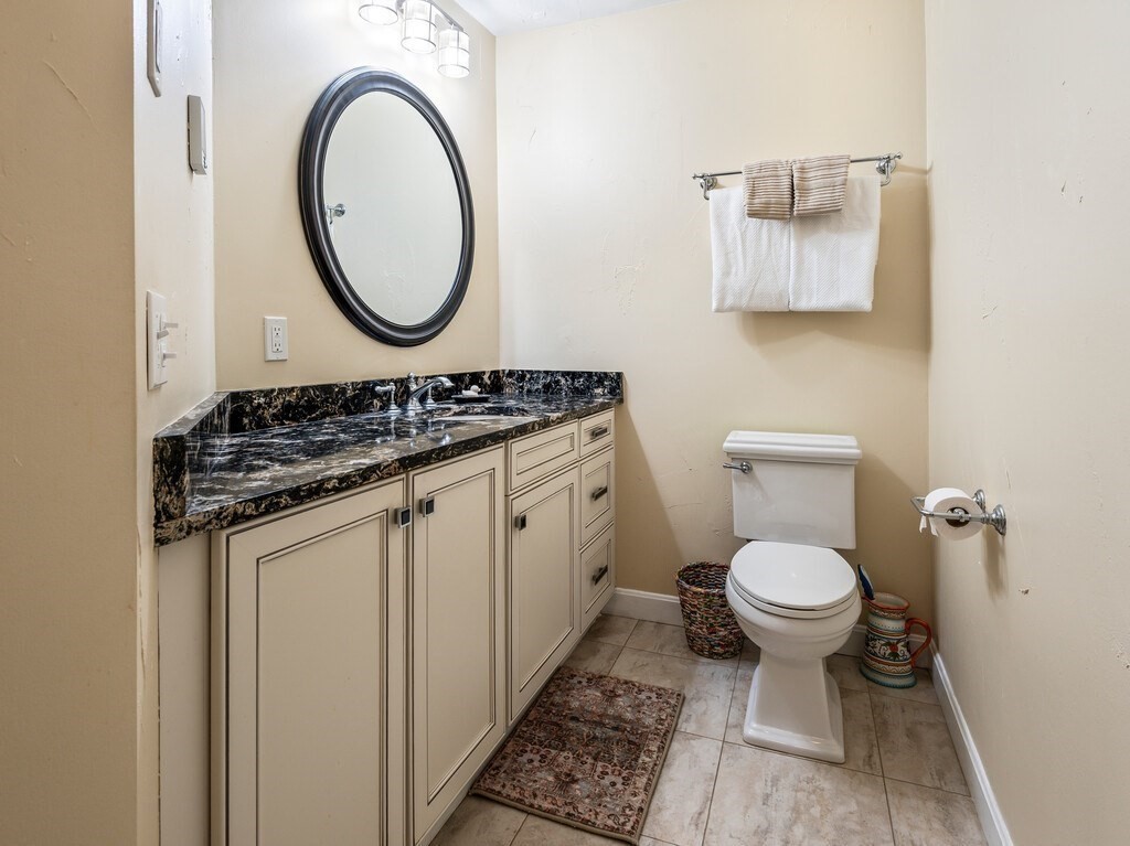 8 Montvale Road Worcester, MA 01609 - Photo 16 of 31 a bathroom with a toilet a sink and a mirror